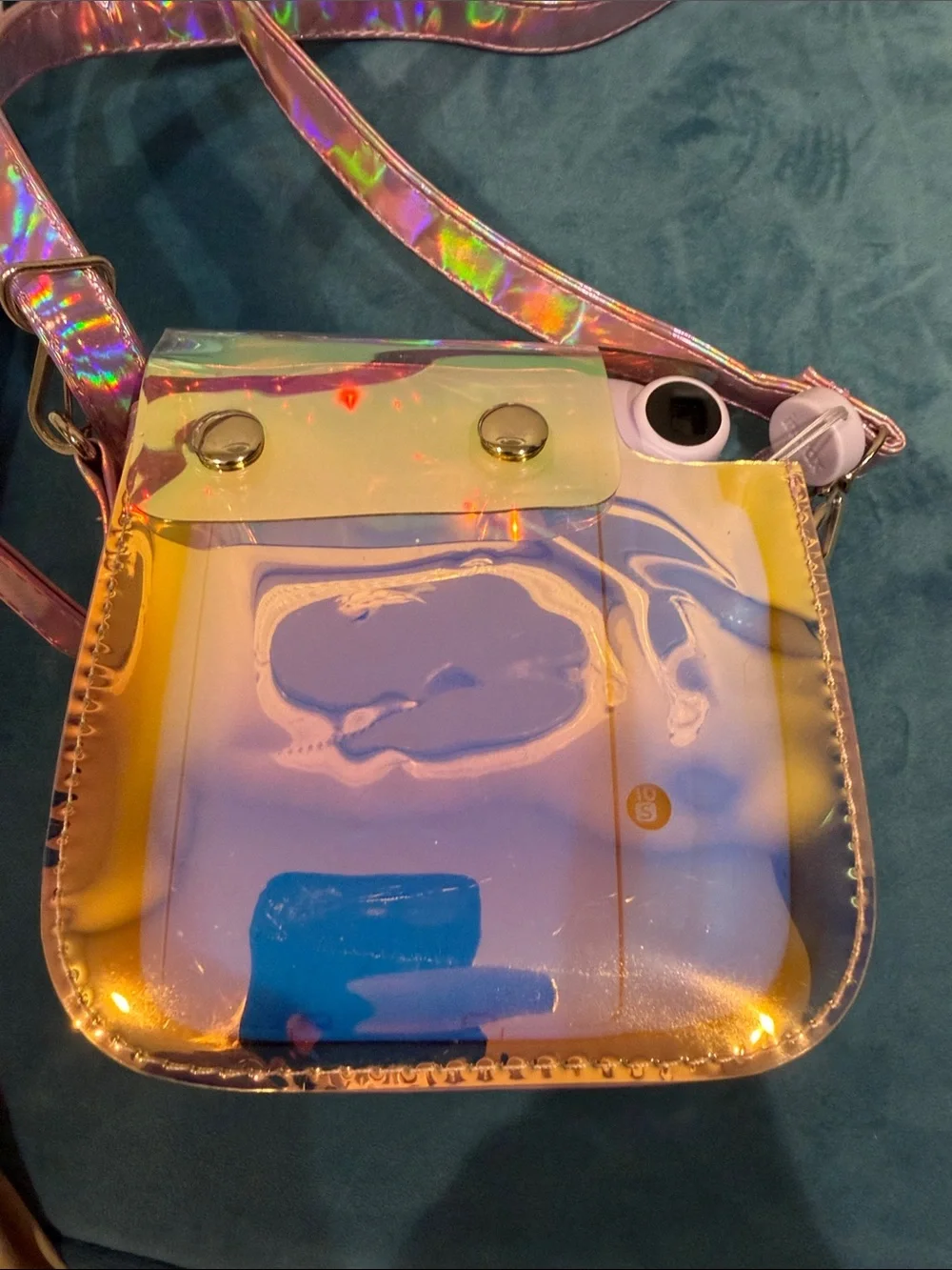 Fujifilm instax mini 11 camera with stylish metallic cross body bag.